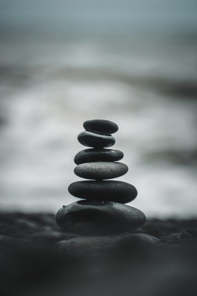 A stack of balanced rocks on a beach. 
